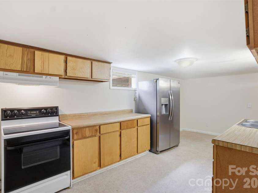 5835 Kreps Road, Clover, SC 29710.  MLS# CAR4397393, YatesRealty ID 33188. Basement kitchen