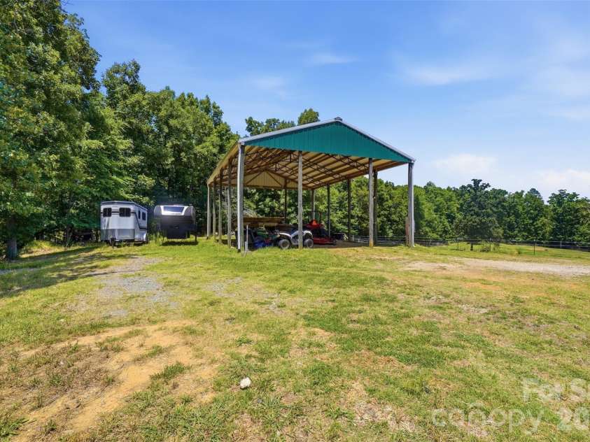 5835 Kreps Road, Clover, SC 29710.  MLS# CAR4397393, YatesRealty ID 33188. RV Storage with 50 amp hook up