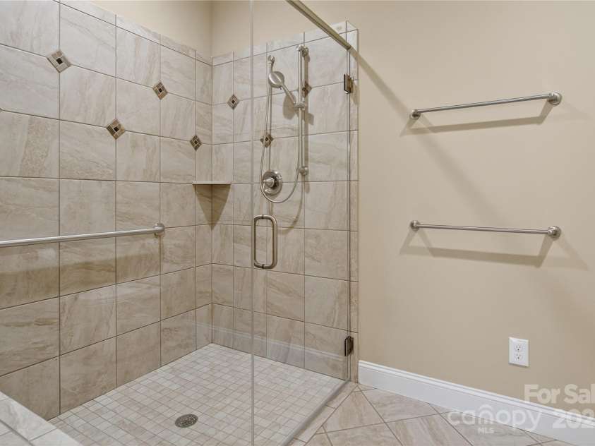 8505 Van Court, Denver, NC 28037.  MLS# CAR4289958, YatesRealty ID 33188. Primary Bathroom Step-free shower with bench and handle bar