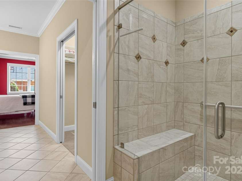 8505 Van Court, Denver, NC 28037.  MLS# CAR4289958, YatesRealty ID 33188. Primary Bathroom Step-free shower with bench and handle bar