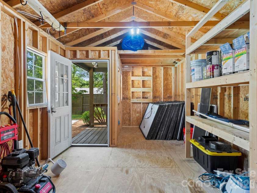 26 Glen Cove Road, Arden, NC 28704.  MLS# CAR4394525, YatesRealty ID 33191. Storage shed. Note solar panels. House wired for solar.
