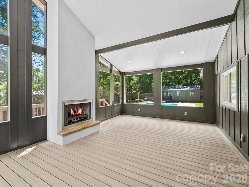26 Glen Cove Road, Arden, NC 28704.  MLS# CAR4394525, YatesRealty ID 33191. Vented gas logs with Trex decking