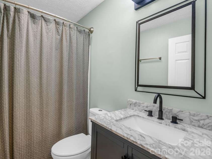 30 Lake Forest Lane, Hendersonville, NC 28739.  MLS# CAR4394922, YatesRealty ID 33193. Full bath