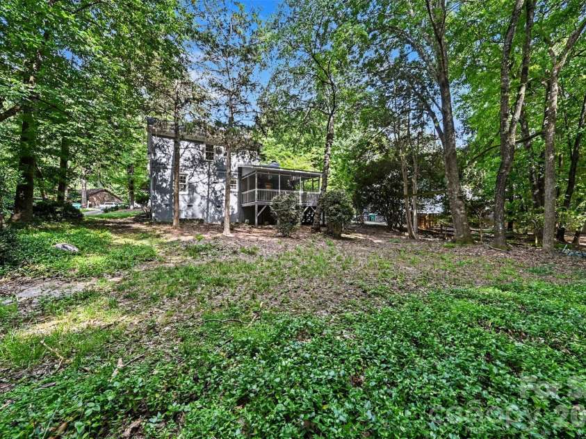 9322 New Towne Drive, Matthews, NC 28105.  MLS# CAR4389735, YatesRealty ID 33195. Expansive natural backyard