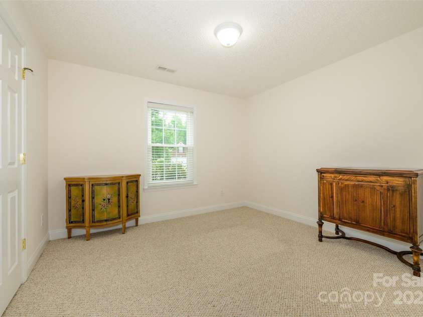 12617 Hill Pine Road, Midland, NC 28107.  MLS# CAR4291136, YatesRealty ID 33201. The second of two bedrooms with Berber carpeting and 2