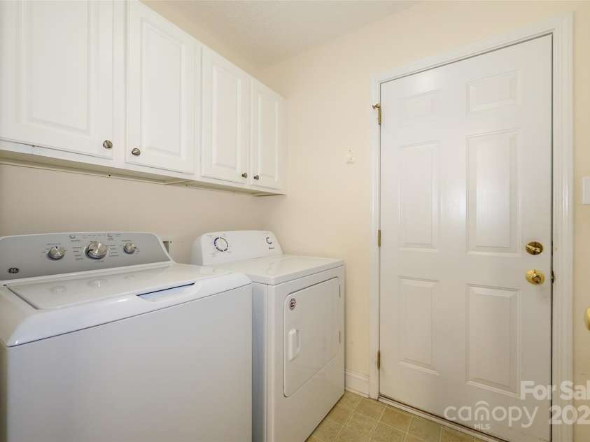 12617 Hill Pine Road, Midland, NC 28107.  MLS# CAR4291136, YatesRealty ID 33201. This laundry set up in the utility room is perfectly located for ease! And plenty of cabinet space to avoid a messy look!  What you can't see?  The 