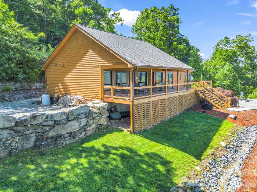 1025 Jeter Mountain Road, Penrose, NC 28766.  MLS# CAR4397105, YatesRealty ID 33202. Boulder walls add additional beauty
