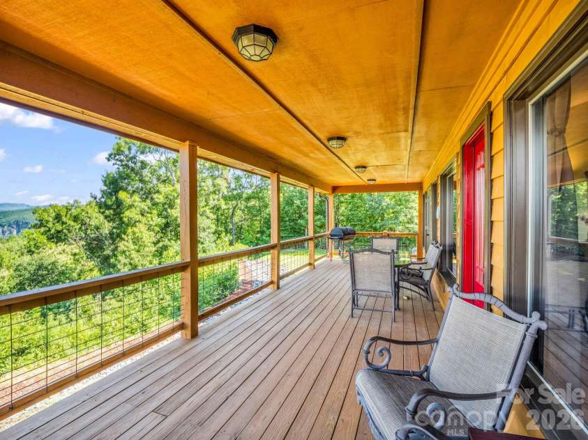 1025 Jeter Mountain Road, Penrose, NC 28766.  MLS# CAR4397105, YatesRealty ID 33202. Covered portion of deck