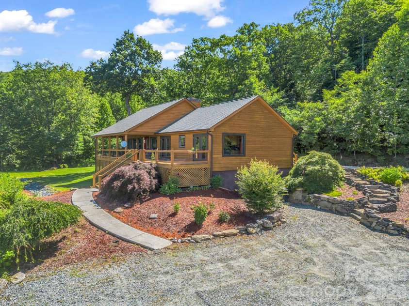 1025 Jeter Mountain Road, Penrose, NC 28766.  MLS# CAR4397105, YatesRealty ID 33202. Home view from campsites