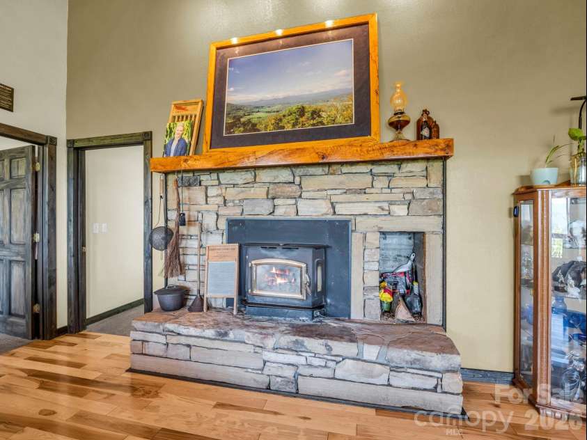 1025 Jeter Mountain Road, Penrose, NC 28766.  MLS# CAR4397105, YatesRealty ID 33202. Living level masonry fireplace basement level also has fireplace
