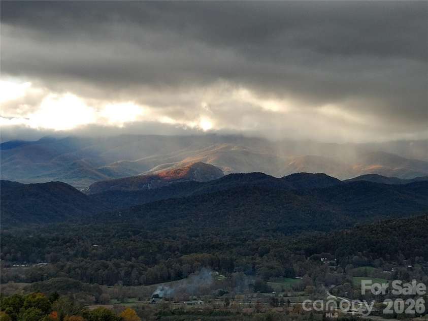 1025 Jeter Mountain Road, Penrose, NC 28766.  MLS# CAR4397105, YatesRealty ID 33202. Looking Glass Rock centerpiece out kitchen window