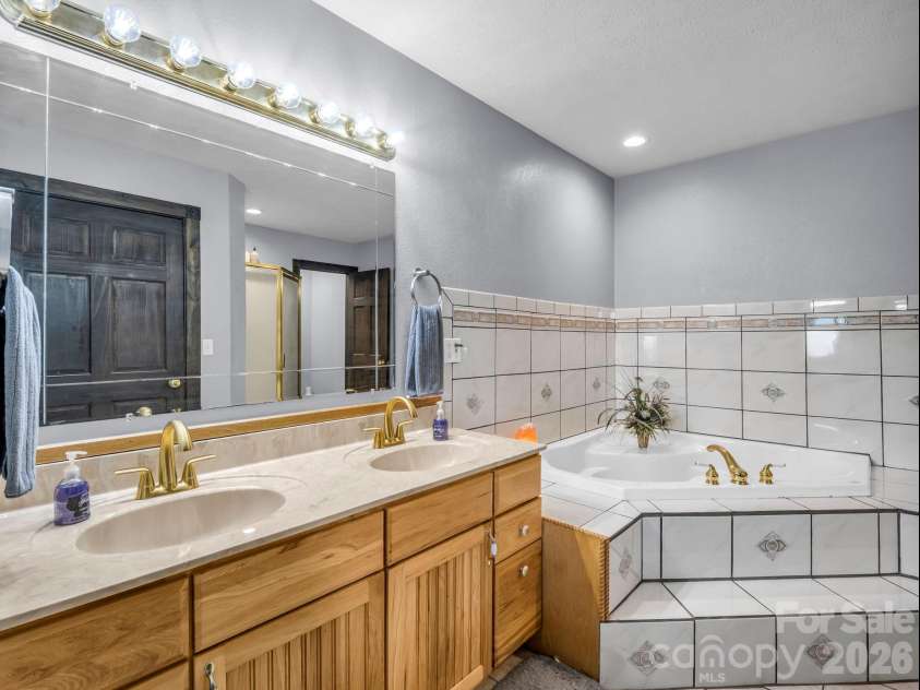 1025 Jeter Mountain Road, Penrose, NC 28766.  MLS# CAR4397105, YatesRealty ID 33202. Primary bathroom
