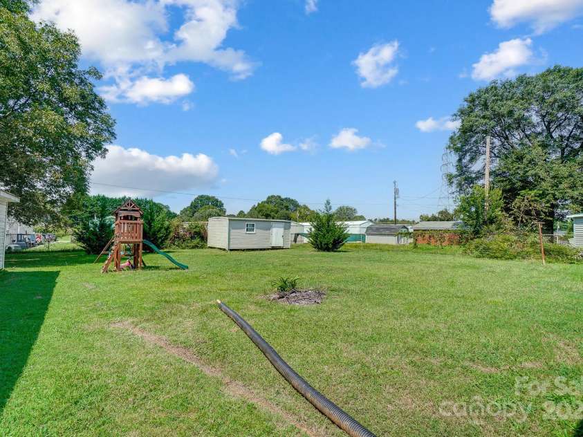 115 Abernathy Street, Mount Holly, NC 28120.  MLS# CAR4181157, YatesRealty ID 3321. Backyard