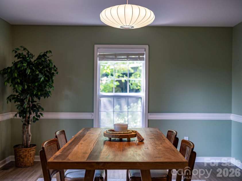 1 Pickwick Road, Asheville, NC 28803.  MLS# CAR4383944, YatesRealty ID 33210. Doing room with modern light fixture.