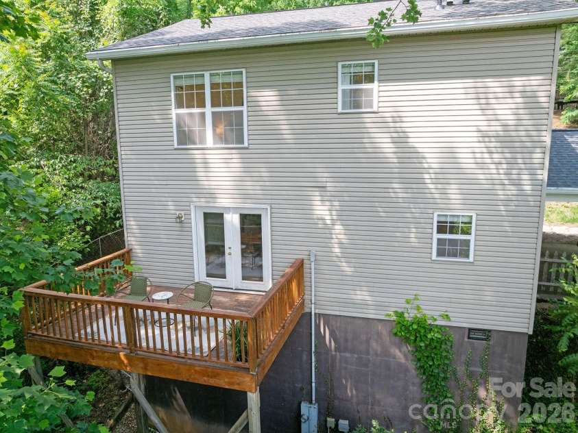 1 Pickwick Road, Asheville, NC 28803.  MLS# CAR4383944, YatesRealty ID 33210. Enjoy a winter mountain view from your deck in the woods.