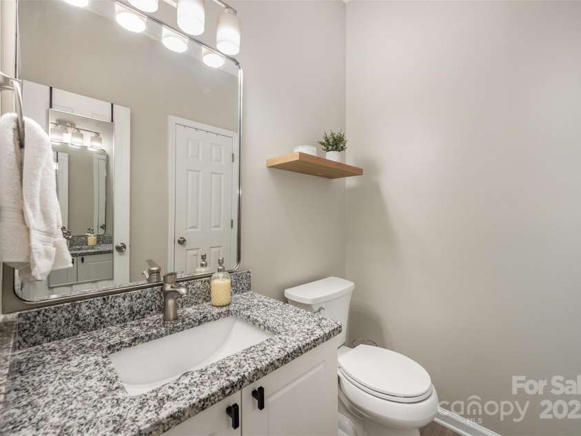 12223 Savannah Garden Drive, Charlotte, NC 28273.  MLS# CAR4274964, YatesRealty ID 33210. Half bath downstairs with huge storage closet