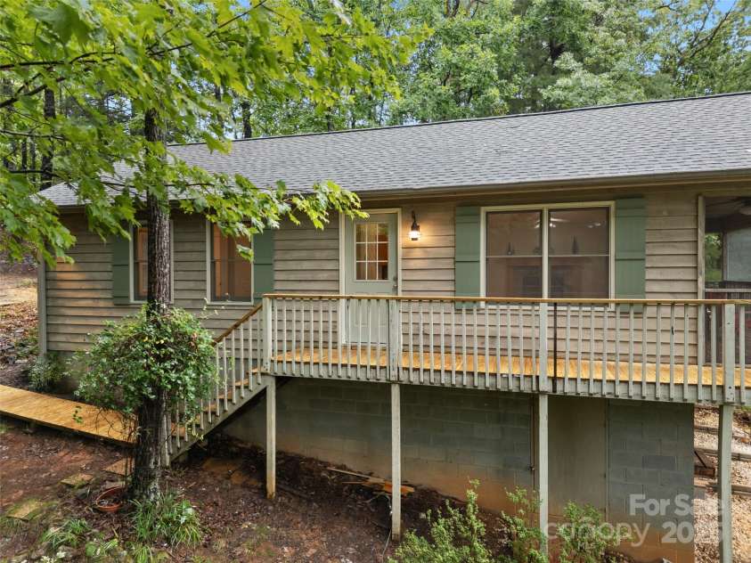 148 Piney Overlook Lane, Saluda, NC 28773.  MLS# CAR4284735, YatesRealty ID 33213. Nestled in the trees