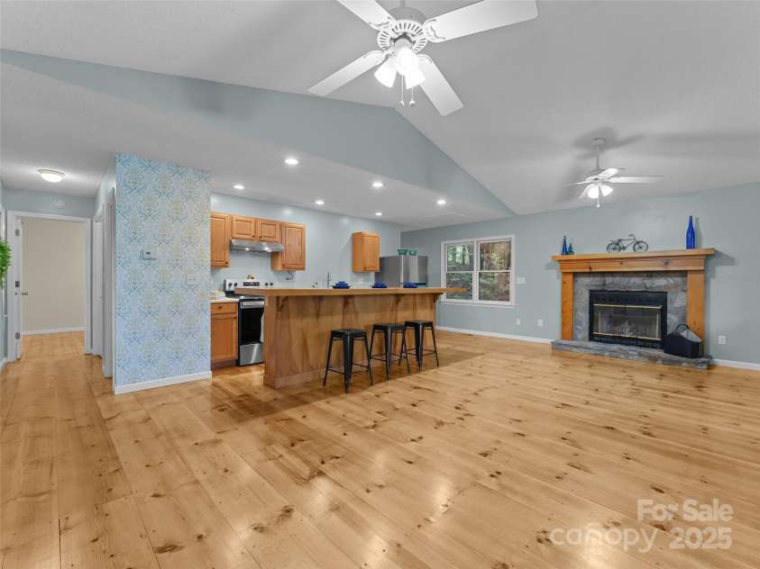 148 Piney Overlook Lane, Saluda, NC 28773.  MLS# CAR4284735, YatesRealty ID 33213. Open kitchen and living room