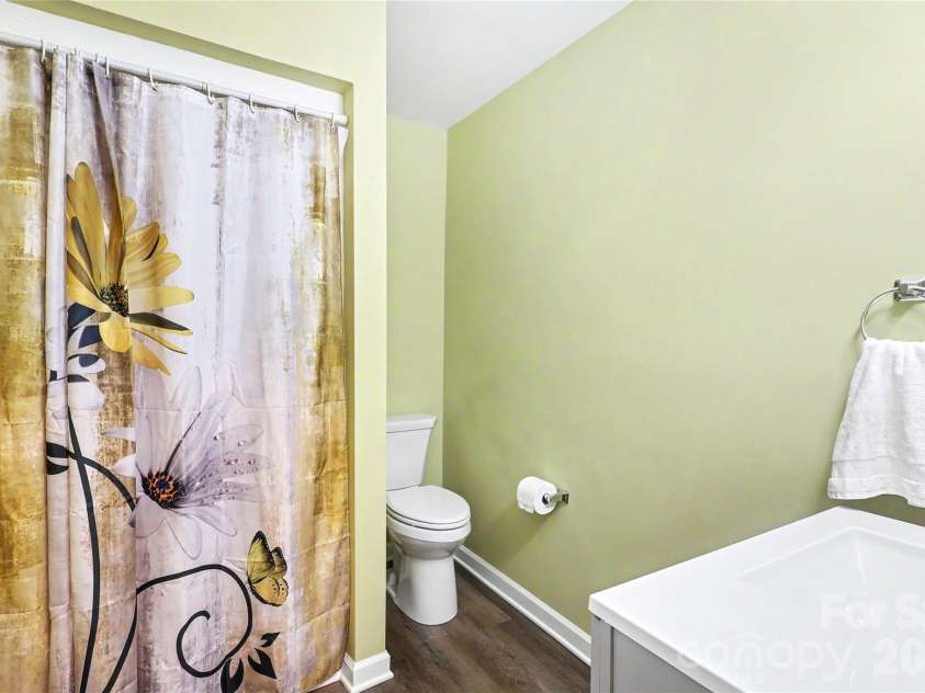 227 Dileen Drive, Concord, NC 28025.  MLS# CAR4396779, YatesRealty ID 33219. The downstairs full Bathroom is centrally located