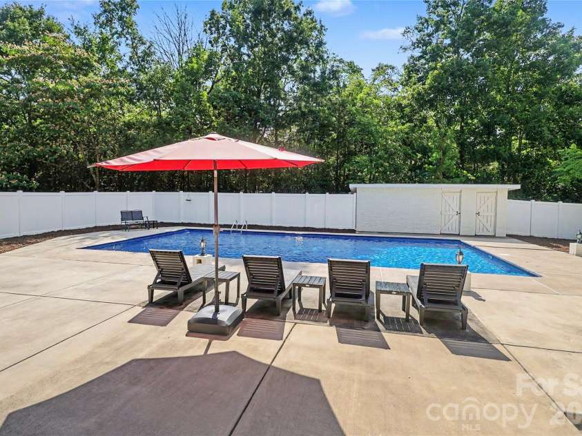 227 Dileen Drive, Concord, NC 28025.  MLS# CAR4396779, YatesRealty ID 33219. The Pool also includes a building that can be used for pool accessories
