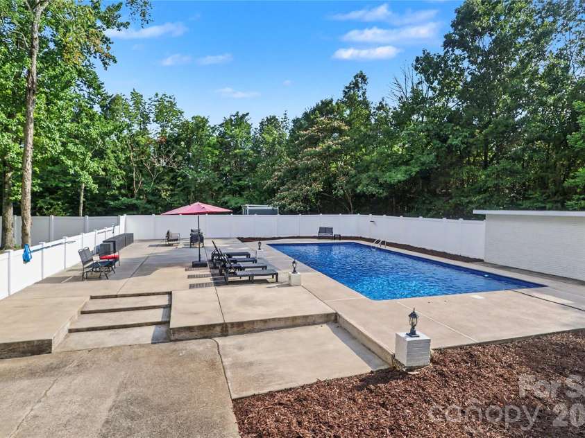 227 Dileen Drive, Concord, NC 28025.  MLS# CAR4396779, YatesRealty ID 33219. View from the Kitchen of the Pool