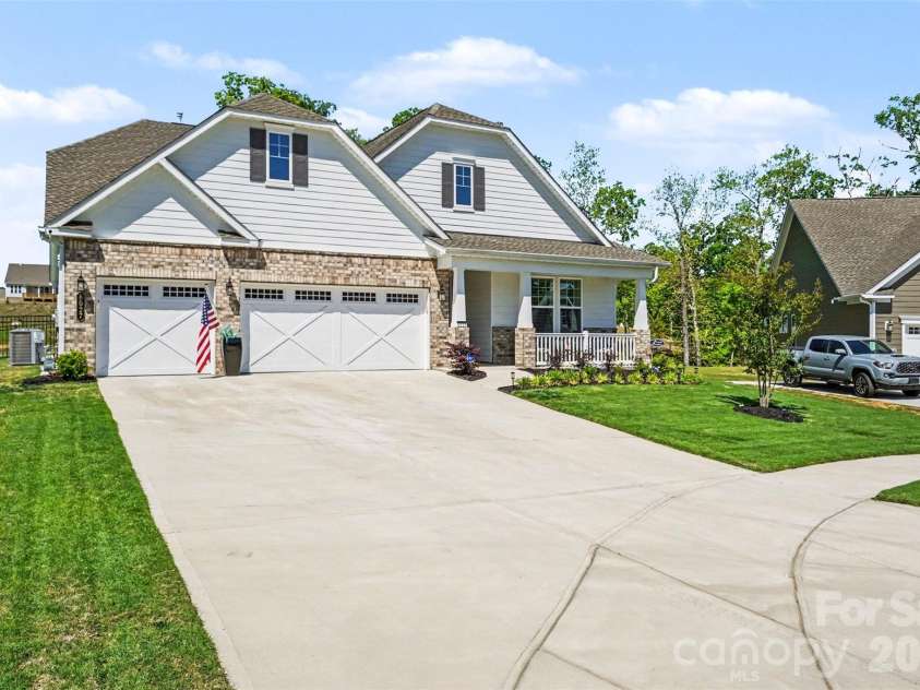 8027 Longwaters Court, York, SC 29745.  MLS# CAR4426129, YatesRealty ID 33228. Three-car garage and an expansive driveway, so parking is never a problem.