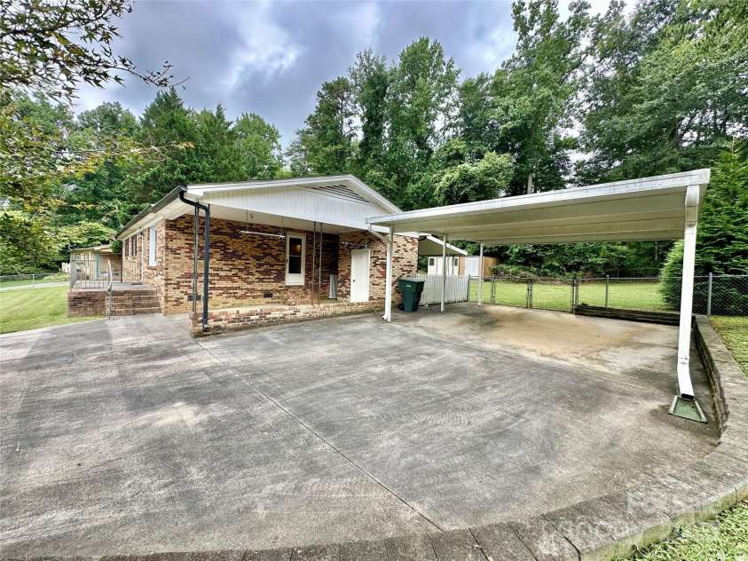 4705 Can Do Court, Gastonia, NC 28056.  MLS# CAR4287219, YatesRealty ID 33229. Extra large driveway with two carports