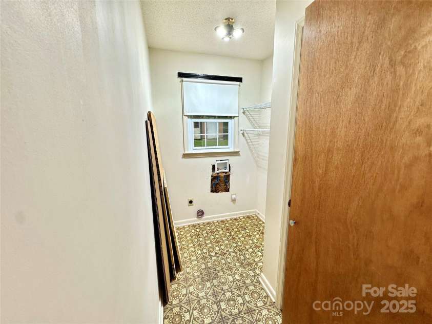 4705 Can Do Court, Gastonia, NC 28056.  MLS# CAR4287219, YatesRealty ID 33229. Laundry room in hallway- with closet