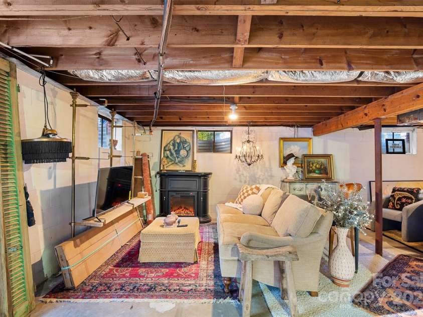 112 Pearson Drive, Asheville, NC 28801.  MLS# CAR4322267, YatesRealty ID 3323. Endless possibilities: art studio, workshop, or finish it your way as a bonus living space!