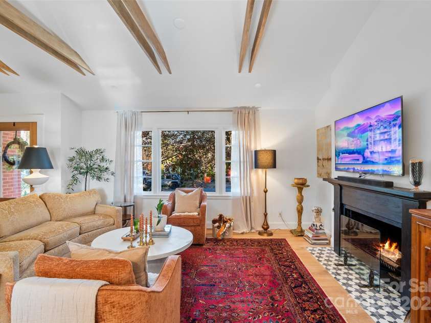 112 Pearson Drive, Asheville, NC 28801.  MLS# CAR4322267, YatesRealty ID 3323. Notice the exposed beams, vaulted ceilings, and the beautiful tile choices on the fireplace hearth. No expense was spared in the thoughtful details that make this home a classic, timeless joy to live in.