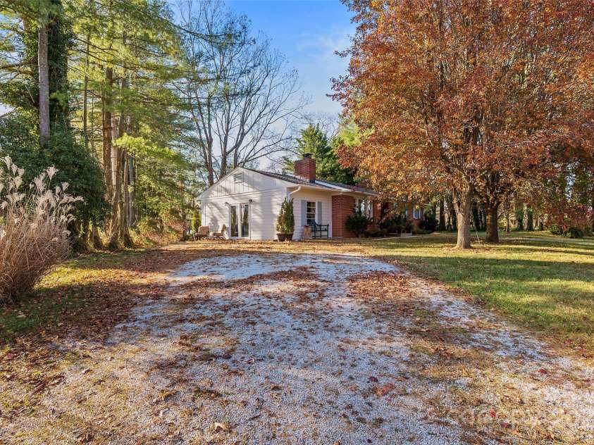 112 Pearson Drive, Asheville, NC 28801.  MLS# CAR4322267, YatesRealty ID 3323. Set back on a corner lot with plenty of room, this private home makes coming home a joy.