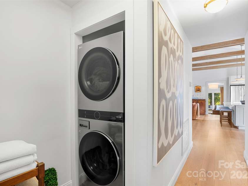 112 Pearson Drive, Asheville, NC 28801.  MLS# CAR4322267, YatesRealty ID 3323. The new stackable washer and dryer are conveniently located off the main hallway, just steps from the primary suite.