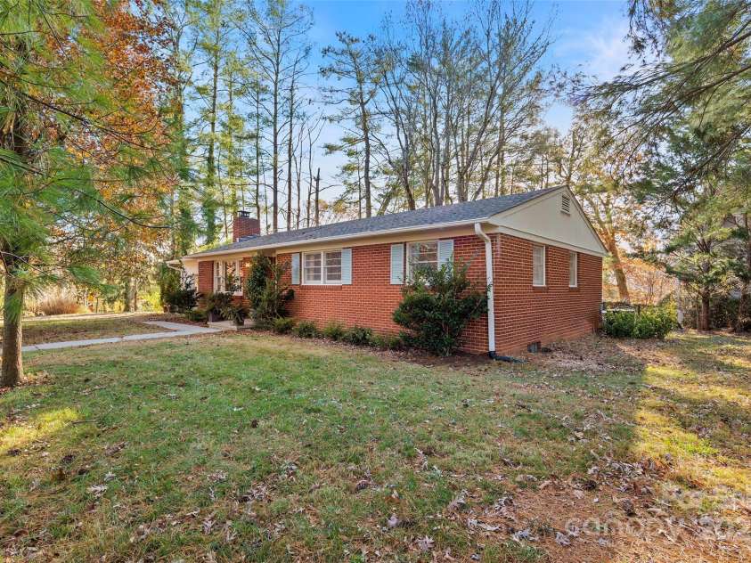 112 Pearson Drive, Asheville, NC 28801.  MLS# CAR4322267, YatesRealty ID 3323. View of the home from the street toward showing the beautiful, level front yard. 