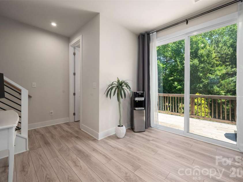 1630 Unison Drive, Charlotte, NC 28262.  MLS# CAR4383072, YatesRealty ID 33230. Kitchen provides direct access to the rear balcony