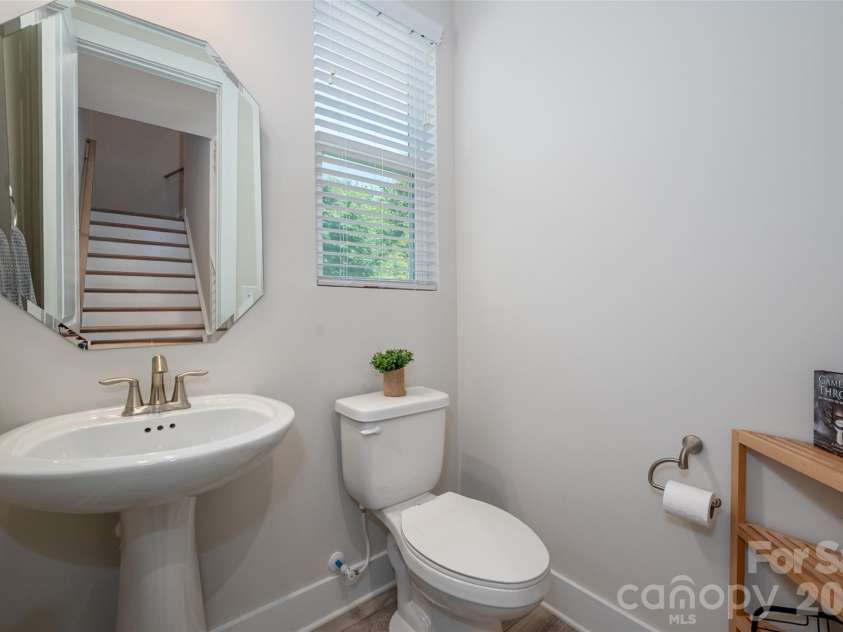 1630 Unison Drive, Charlotte, NC 28262.  MLS# CAR4383072, YatesRealty ID 33230. Main level featues a poweder room