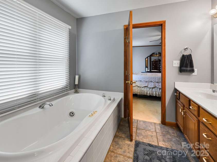 20 Brooks Cove Road, Candler, NC 28715.  MLS# CAR4255964, YatesRealty ID 33230. Main bath