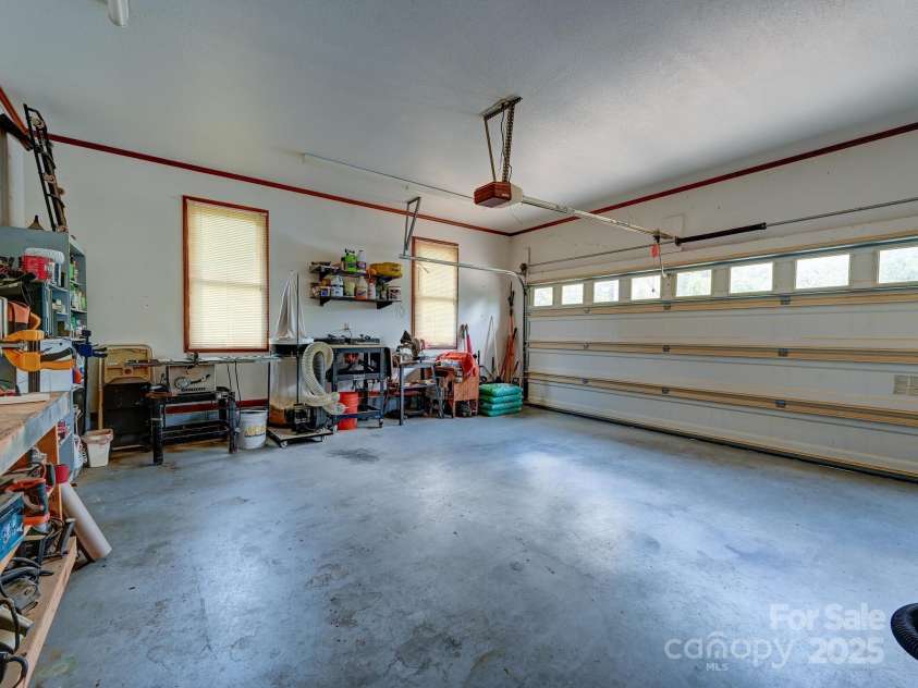 20 Brooks Cove Road, Candler, NC 28715.  MLS# CAR4255964, YatesRealty ID 33230. Spacious garage - and don't miss the extra storage room on your right!