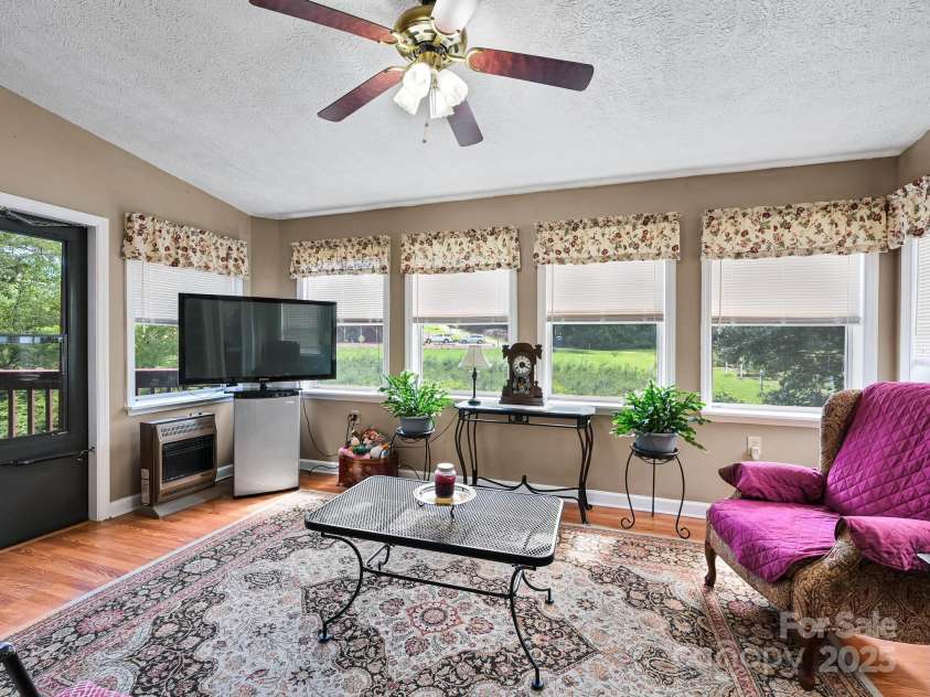 20 Brooks Cove Road, Candler, NC 28715.  MLS# CAR4255964, YatesRealty ID 33230. Sun room for all seasons