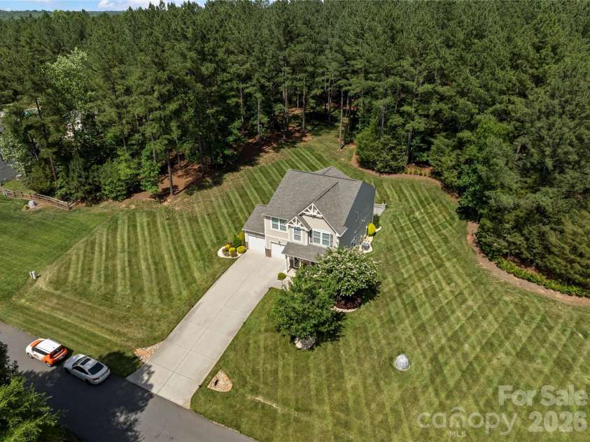 8122 Mossy Rock Road, Waxhaw, NC 28173.  MLS# CAR4382633, YatesRealty ID 33242. Drone full exterior