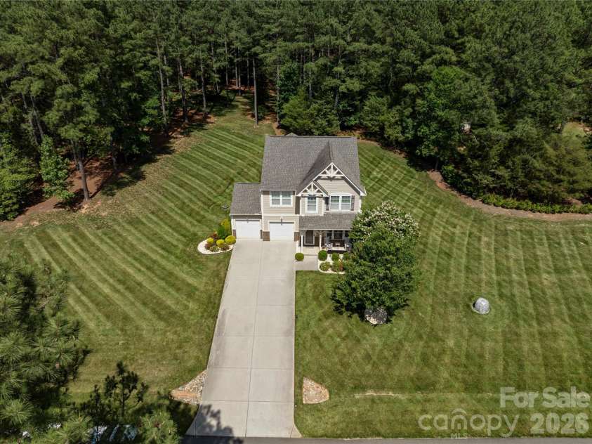 8122 Mossy Rock Road, Waxhaw, NC 28173.  MLS# CAR4382633, YatesRealty ID 33242. Drone full exterior