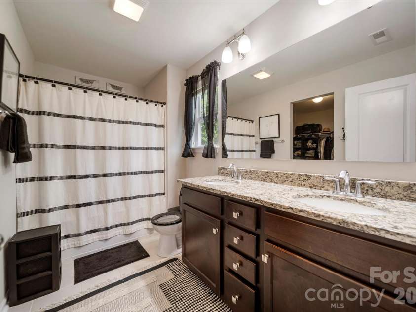 8122 Mossy Rock Road, Waxhaw, NC 28173.  MLS# CAR4382633, YatesRealty ID 33242. Primary bathroom