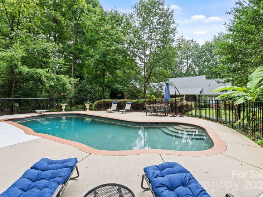 501 Colonels Court, Clover, SC 29710.  MLS# CAR4288032, YatesRealty ID 33243. Enjoy lounging poolside in the privacy of your back yard