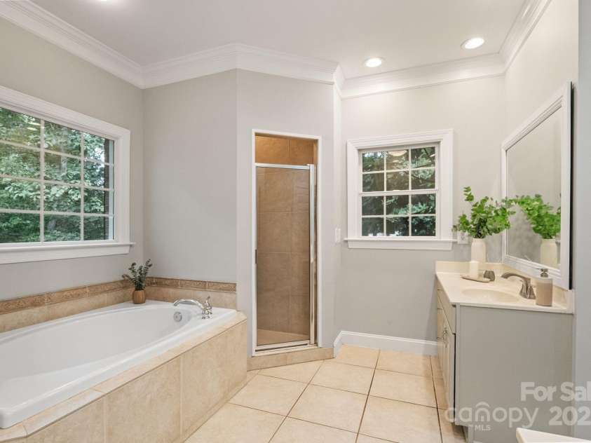 501 Colonels Court, Clover, SC 29710.  MLS# CAR4288032, YatesRealty ID 33243. Garden tub and stand alone shower in the primary bathroom