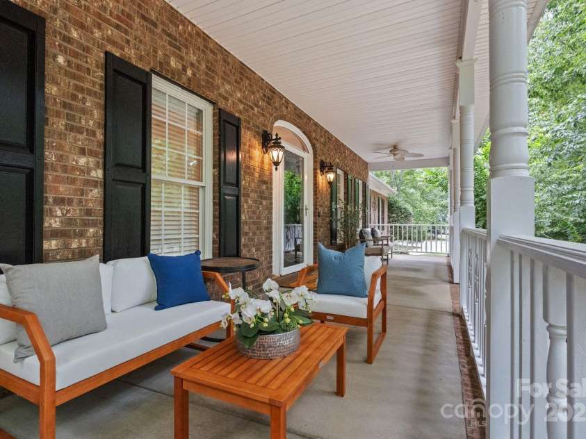 501 Colonels Court, Clover, SC 29710.  MLS# CAR4288032, YatesRealty ID 33243. Large front porch- perfect for sitting out, listening to nature and relaxing