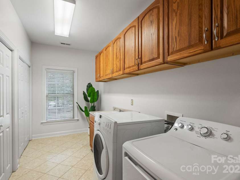 501 Colonels Court, Clover, SC 29710.  MLS# CAR4288032, YatesRealty ID 33243. Main level laundry room with plenty of room in the storage closets and cabinets