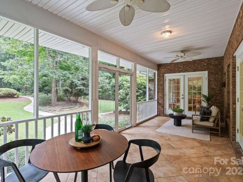 501 Colonels Court, Clover, SC 29710.  MLS# CAR4288032, YatesRealty ID 33243. The back porch is fully screened in to comfortably enjoy your time outdoors relaxing or entertaining- whichever makes you happy in the moment