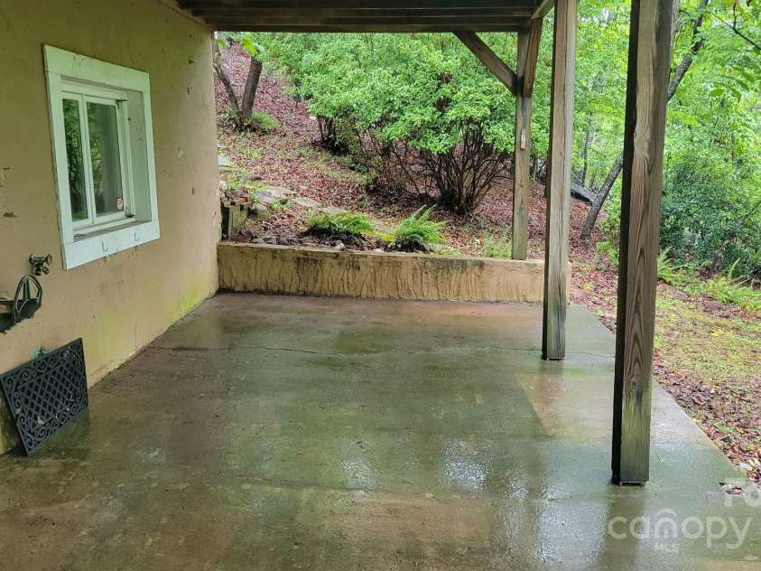 430 Laurel Heights Lane, Tryon, NC 28782.  MLS# CAR4277530, YatesRealty ID 33245. Basement porch