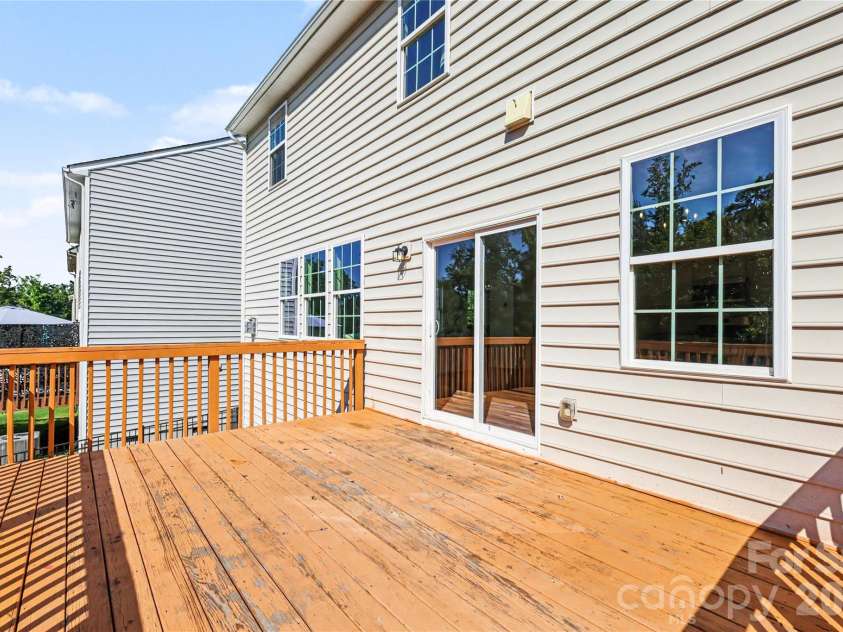 1648 Trentwood Drive, Fort Mill, SC 29715.  MLS# CAR4394404, YatesRealty ID 33250. Access the spacious back deck from the breakfast area