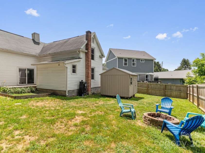 761 Main Street, Canton, NC 28716.  MLS# CAR4281762, YatesRealty ID 33252. Storage shed and fire pit