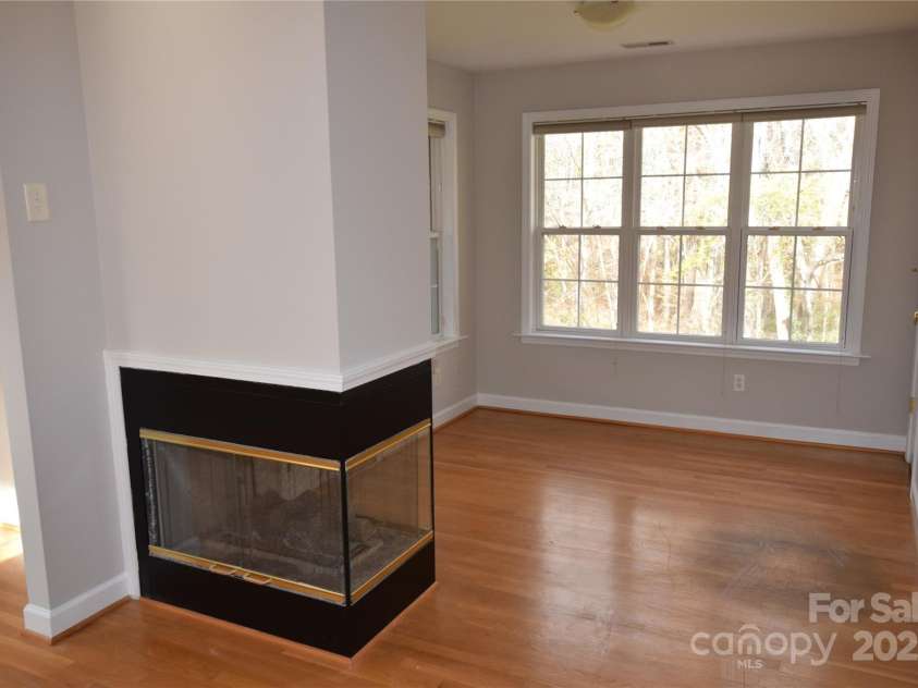 809 Pine Forest Road, Charlotte, NC 28214.  MLS# CAR4203407, YatesRealty ID 3326. Primary bedroom sitting area with gas fireplace.